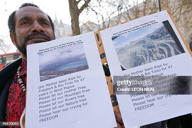 Benny Wenda, leader of the West Papuan Independence Movement, protests outside the QE2 centre in central London, as Anglo-Australian mining company...