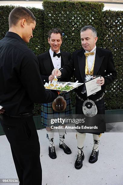 Guests are served appetizers prepared by Crumble Catering at the Elton John AIDS Foundation Oscar Viewing Party at the Pacific Design Center on March...