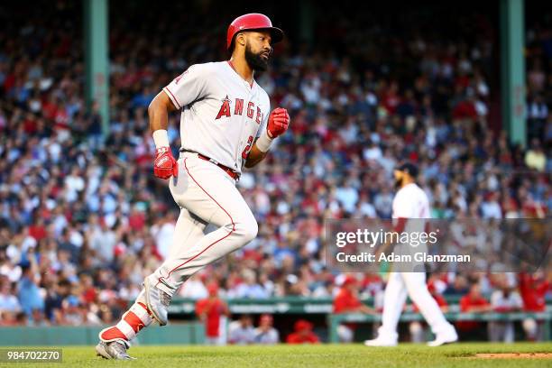 David Price of the Boston Red Sox looks on as Chris Young of the Los Angeles Angels rounds the bases after hitting a solo home run in the third...