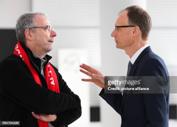 Michael Lohscheller , Chairman of the Board of Opel Automobile GmbH, and the chairman of Opel's general works council, Wolfgang Schaeer-Klug, talking...