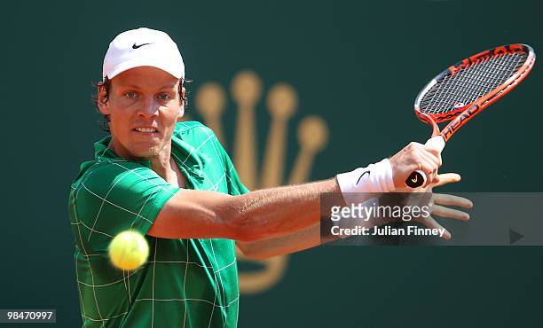 Tomas Berdych of Czech Republic plays a backhand in his match against Fernando Verdasco of Spain during day four of the ATP Masters Series at the...