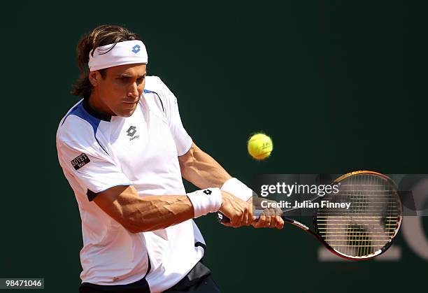 David Ferrer of Spain plays a backhand in his match against Ivan Ljubicic of Croatia during day four of the ATP Masters Series at the Monte Carlo...