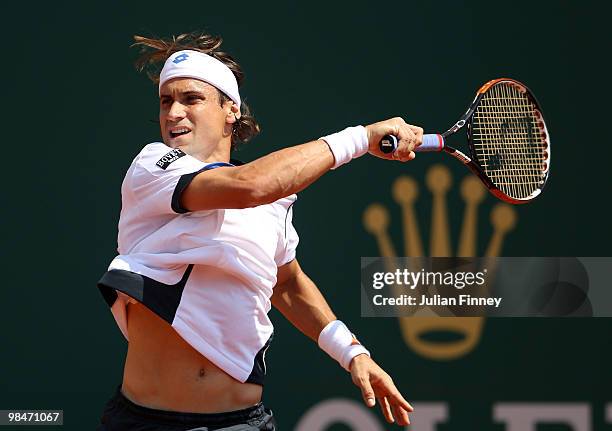 David Ferrer of Spain plays a backhand in his match against Ivan Ljubicic of Croatia during day four of the ATP Masters Series at the Monte Carlo...