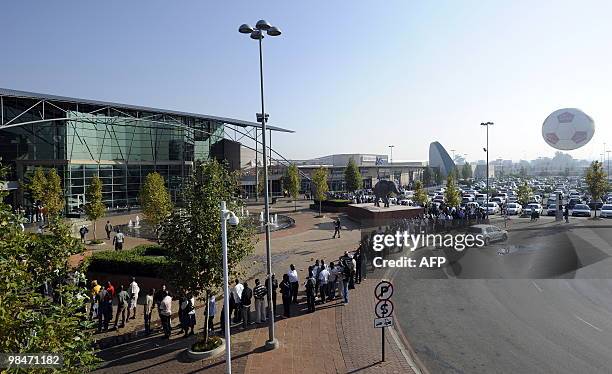 People queue to purchase official 2010 FIFA World Cup tickets on April 15, 2010 at the Maponya shopping mall in Soweto during the first day of the...