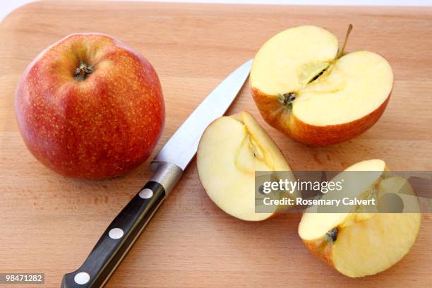 ripe apples being prepared to eat. - haslemere stock pictures, royalty-free photos & images