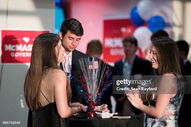 Eleanor Crawford, right, shares a laugh while waiting for results at a Republican gubernatorial primary runoff election watch party at Spirit...