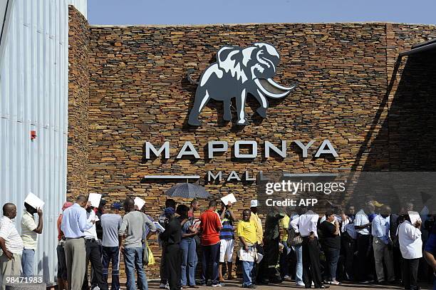 People queue to purchase official 2010 FIFA World Cup tickets on April 15, 2010 at the Maponya shopping mall in Soweto during the first day of the...