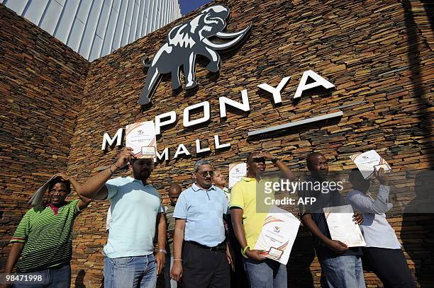 People queue to purchase official 2010 FIFA World Cup tickets on April 15, 2010 at the Maponya shopping mall in Soweto during the first day of the...