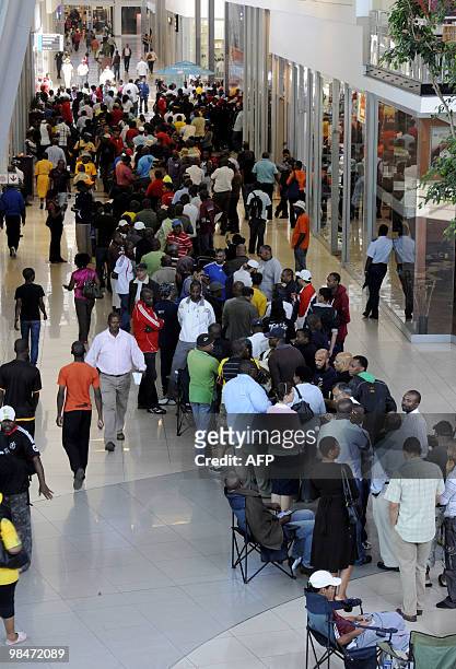 People queue to purchase official 2010 FIFA World Cup tickets on April 15, 2010 at the Maponya shopping mall in Soweto during the first day of the...
