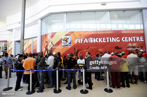 People queue to purchase official 2010 FIFA World Cup tickets on April 15, 2010 at the Maponya shopping mall in Soweto during the first day of the...