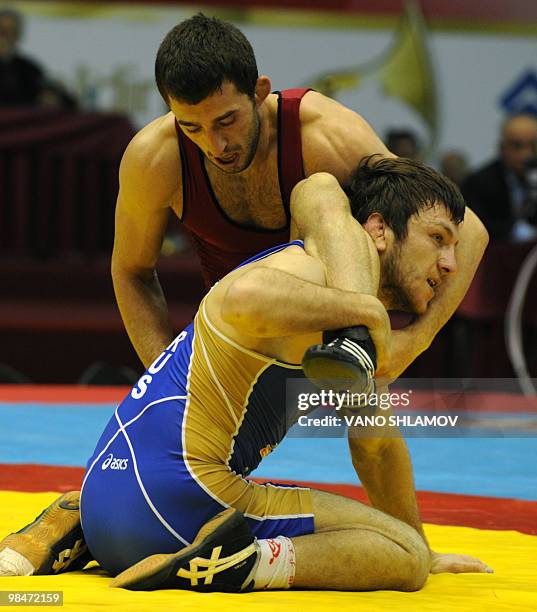 Kiril Stoychev Terziev of Bulgary competes with Denis Tsarguish of Russia during the Freestyle Wrestling 74kg gold medal match at the Senior...