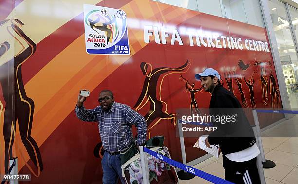 Man shows his Identity card he needs to purchase official 2010 FIFA World Cup tickets on April 15, 2010 at the Maponya shopping mall in Soweto during...