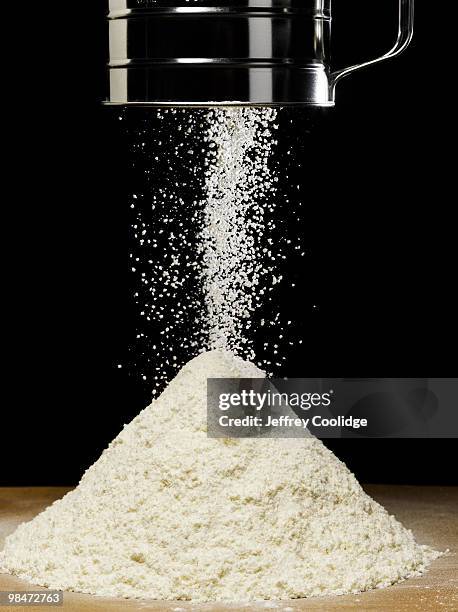 sifting baking flour - flour sifter stock pictures, royalty-free photos & images