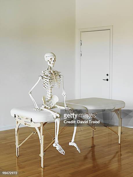 human skeleton waiting at a clinic.   - david trood stockfoto's en -beelden