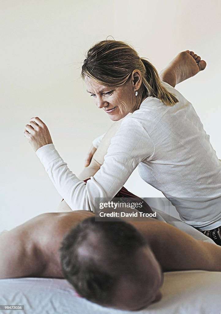 Woman giving healing massage.