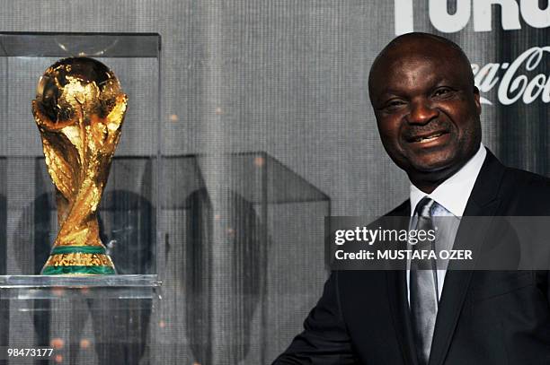 Former Cameroon footbal player Roger Milla poses with the FIFA World Cup trophy during a presentation on April 14, 2010 in Istanbul. The World Cup...