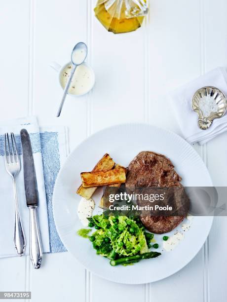 steak and chips on plate overhead - prepared potato stock pictures, royalty-free photos & images