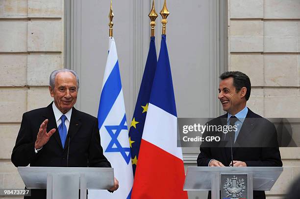 In this handout image from the Israeli Government Press Office, French President Nicholas Sarkozy holds a press conference with Israeli President...