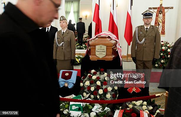 Mourners pass by in silence at the coffin of late Polish President Lech Kaczynski lying in state in the Presidential Palace on April 15, 2010 in...