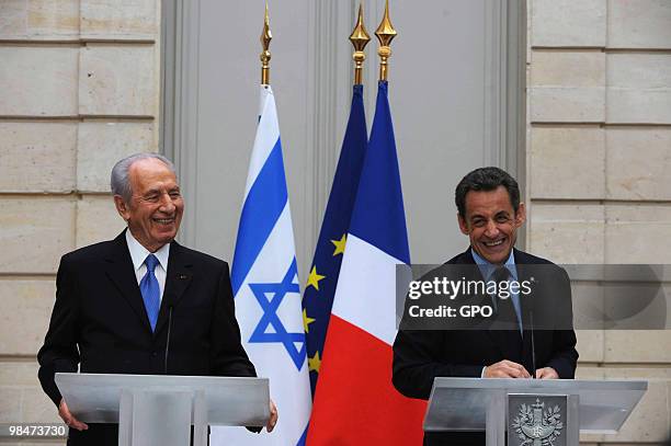 In this handout image from the Israeli Government Press Office, French President Nicholas Sarkozy holds a press conference with Israeli President...