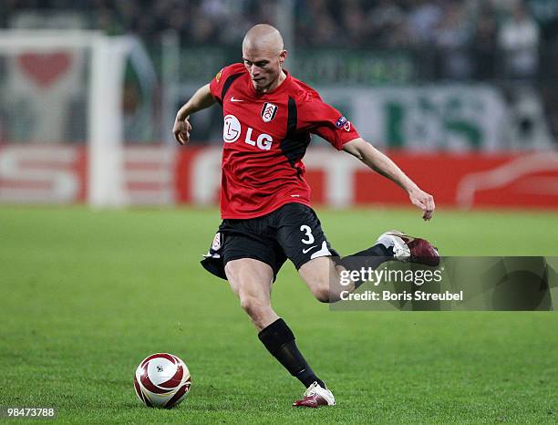 Paul Konchesky of Fulham runs with the ball during the UEFA Europa League quarter final second leg match between VfL Wolfsburg and Fulham FC at...