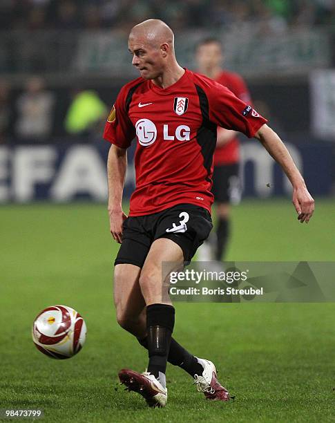 Paul Konchesky of Fulham runs with the ball during the UEFA Europa League quarter final second leg match between VfL Wolfsburg and Fulham FC at...