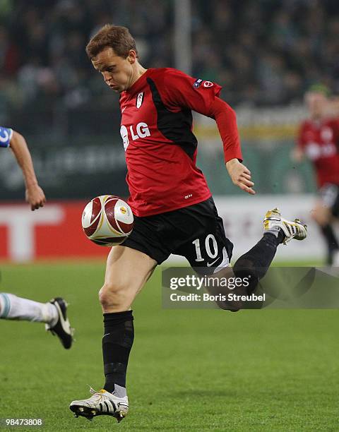 Erik Nevland of Fulham runs with the ball during the UEFA Europa League quarter final second leg match between VfL Wolfsburg and Fulham FC at...
