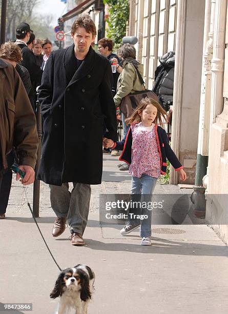 Actor Ethan Hawke and child are seen on location filming "The woman in the Fifth" on April 15, 2010 in Paris, France.