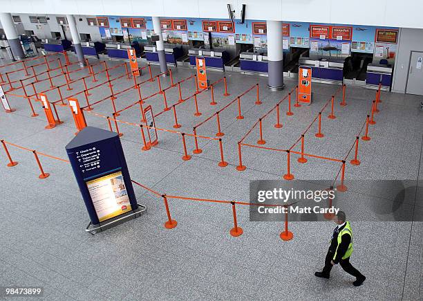 Man walks through the empty departure lounge at Bristol Airport on April 15, 2010 in Bristol, England. All flights in and out of Britain's airports...