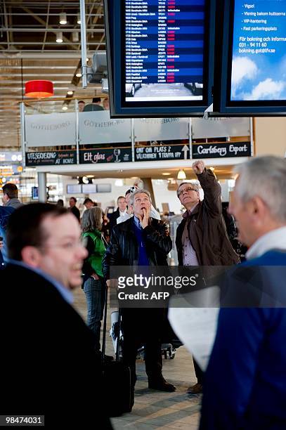 Passengers look at the information monitors at Landvetter Airport outside Gothenburg, on April 15, 2010. Landvetter Airport shut down operations at...