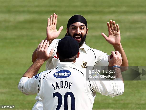 Monty Panesar and Michael Yardy of Sussex celebrates the wicket of Steve Davies of Surrey during the LV County Championship Division Two match...