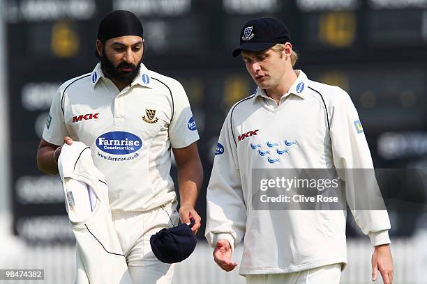 Monty Panesar and Luke Wright of Sussex talk in the field during the LV County Championship Division Two match between Sussex and Surrey at the...