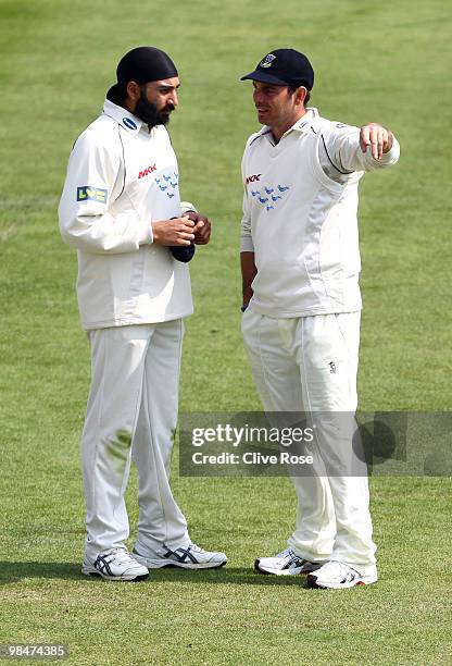 Monty Panesar and Michael Yardy of Sussex talk in the field during the LV County Championship Division Two match between Sussex and Surrey at the...