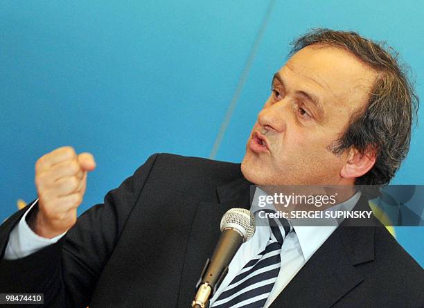 President French Michel Platini shakes his fist as he answers a question during his press-conference after talks with Ukraine's President Viktor...