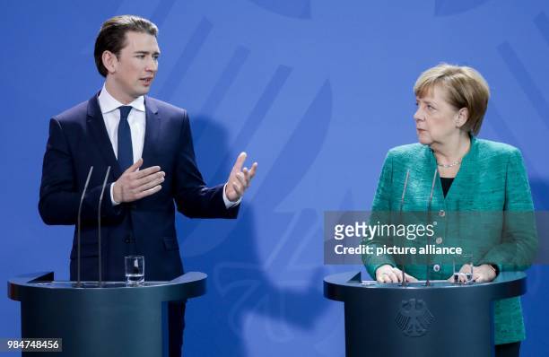 Austrian Chancellor Sebastian Kurz speaks during a press conference with German Chancellor Angela Merkel, after their meeting, at the German...