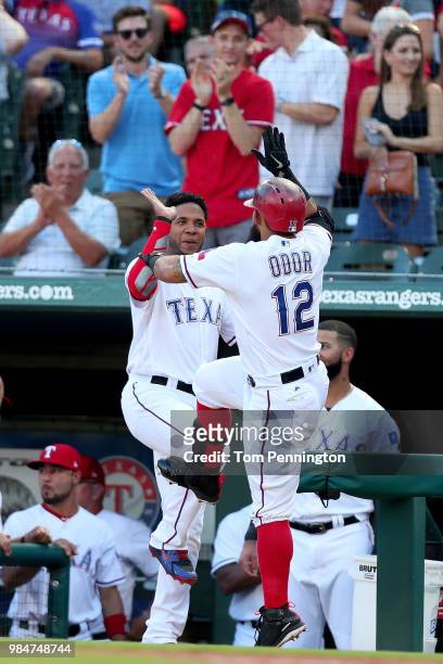 Rougned Odor of the Texas Rangers celebrates with Elvis Andrus of the Texas Rangers after hitting a solo home run against the San Diego Padres in the...