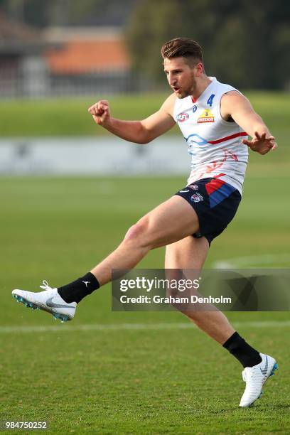 Marcus Bontempelli of the Bulldogs kicks during a training session at Whitten Oval on June 27, 2018 in Melbourne, Australia.