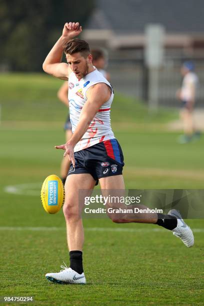 Marcus Bontempelli of the Bulldogs kicks during a training session at Whitten Oval on June 27, 2018 in Melbourne, Australia.