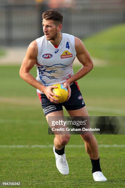 Marcus Bontempelli of the Bulldogs kicks during a training session at Whitten Oval on June 27, 2018 in Melbourne, Australia.