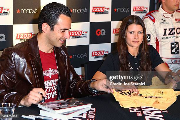 Helio Castroneves and Danica Patrick sign autographs at the IZOD IndyCar Series Autograph Session at South Coast Plaza on April 14, 2010 in Costa...