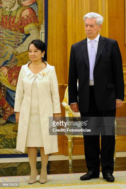 President of Philippines Gloria Macapagal Arroyo and writer Mario Vargs Llosa pose for photographers during 'Don Quijote De La Mancha' International...