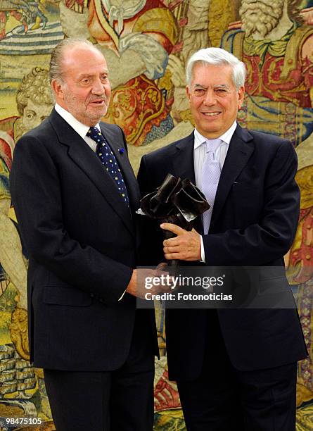 King Juan Carlos of Spain delivers 'Don Quijote De La Mancha' International Award to writer Mario Vargas Llosa, at Zarzuela Palace on April 15, 2010...