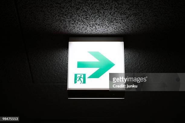 arrow sign - japanese exit sign stock pictures, royalty-free photos & images