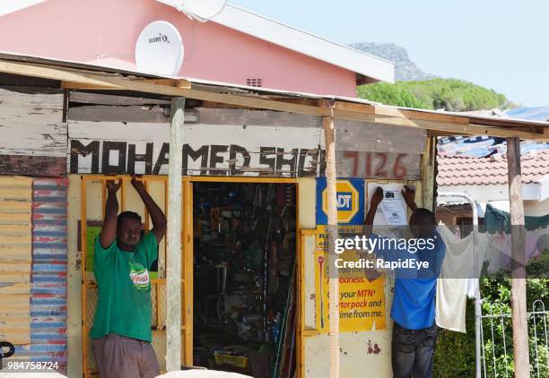 exterior of a general dealer in a south african township - spaza shop stock pictures, royalty-free photos & images