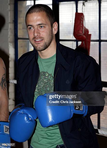 Chelsea footballer Joe Cole steps into the boxing ring during a photocall with his friend and World Title Challenger Kevin Mitchell at TKO Ultrachem...