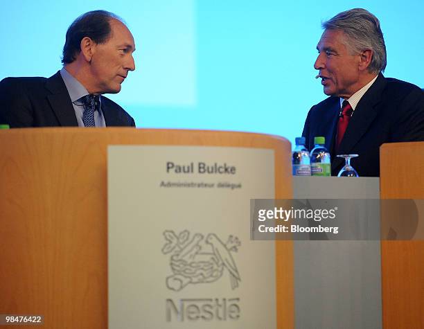 Peter Brabeck-Letmathe, chairman of Nestle SA, right, speaks with Paul Bulcke, chief executive officer of Nestle SA, at the company's shareholders'...