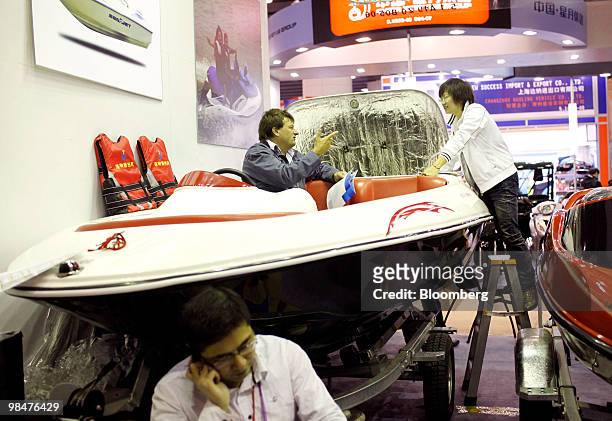Visitors try out a boat at the 107th China Import and Export Fair in Guangzhou, China, on Thursday, April 15, 2010. China's economic growth...