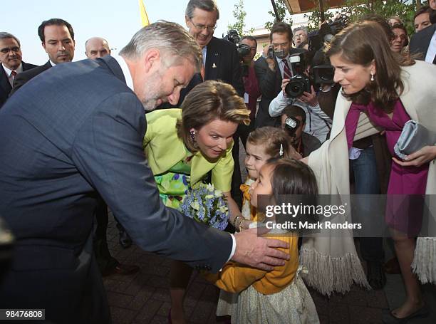 Princess Mathilde of Belgium and Prince Philippe of Belgium receive a birthday cake for Prince Philippe's 50th birthday as they are welcomed at Ghent...