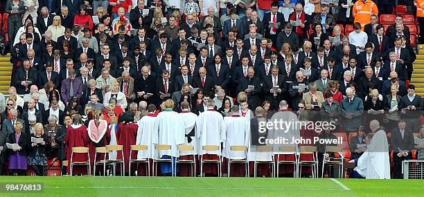 The Liverpool FC squad attends a memorial service on the Kop at Anfield on April 15, 2010 in Liverpool, England. Thousands of fans, friends and...