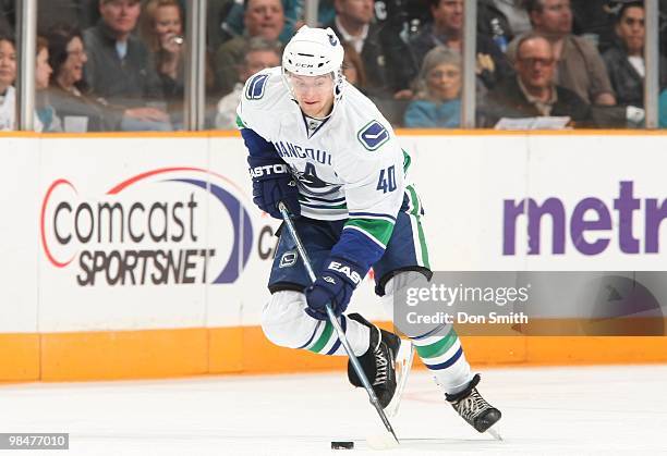 Michael Grabner of the Vancouver Canucks skates with the puck against the San Jose Sharks during an NHL game on April 8, 2010 at HP Pavilion at San...